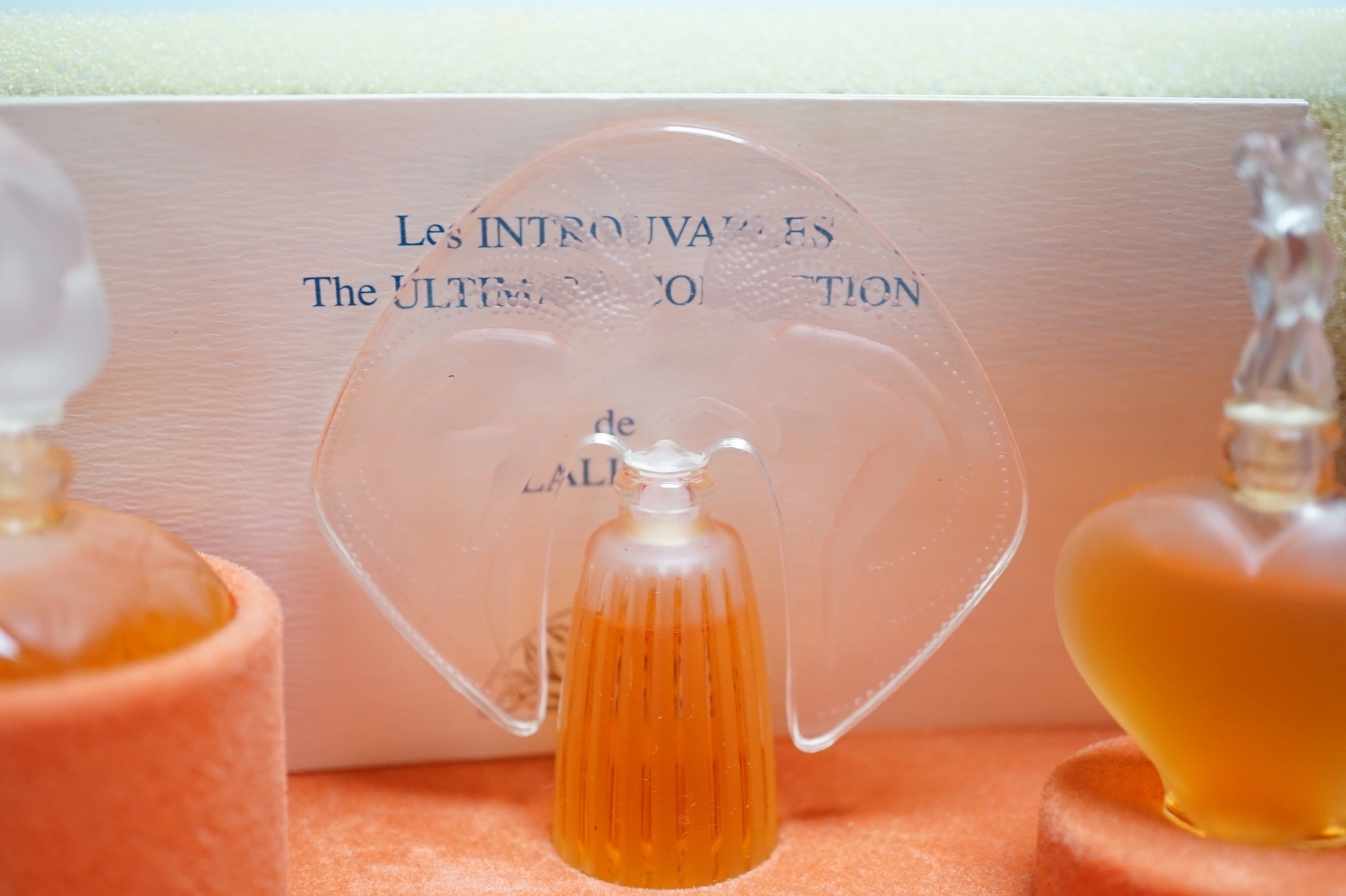 A boxed Lalique Les Introuvables perfume set